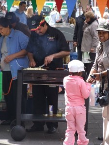 Dos Santos serves up hot portuguese sausages. photo: Danny Hewitt